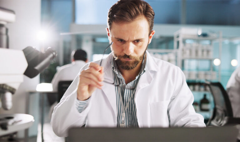 Can a Postdoc Qualify for EB-1A or NIW? Postdoctoral researcher reviewing publications, citations, and immigration evidence.