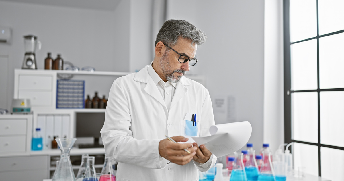 Researcher reviewing EB-1A for researchers evidence including publications, citations, and peer review activity.