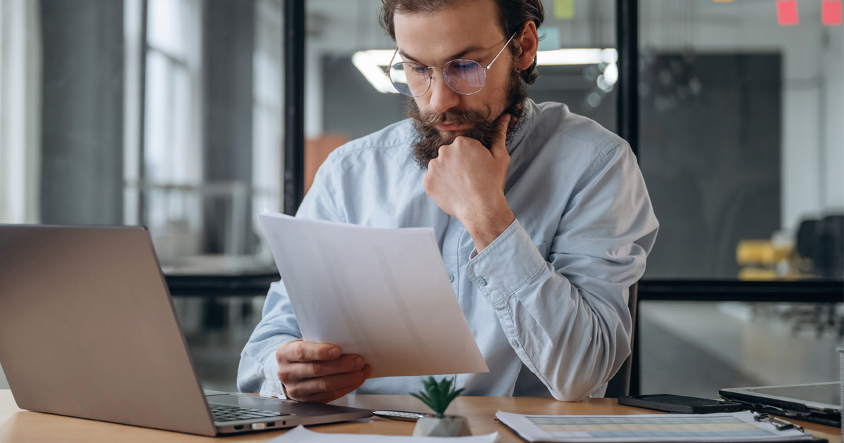 Researcher reviewing EB-1A and NIW Mistakes Researchers commonly make in immigration petitions.