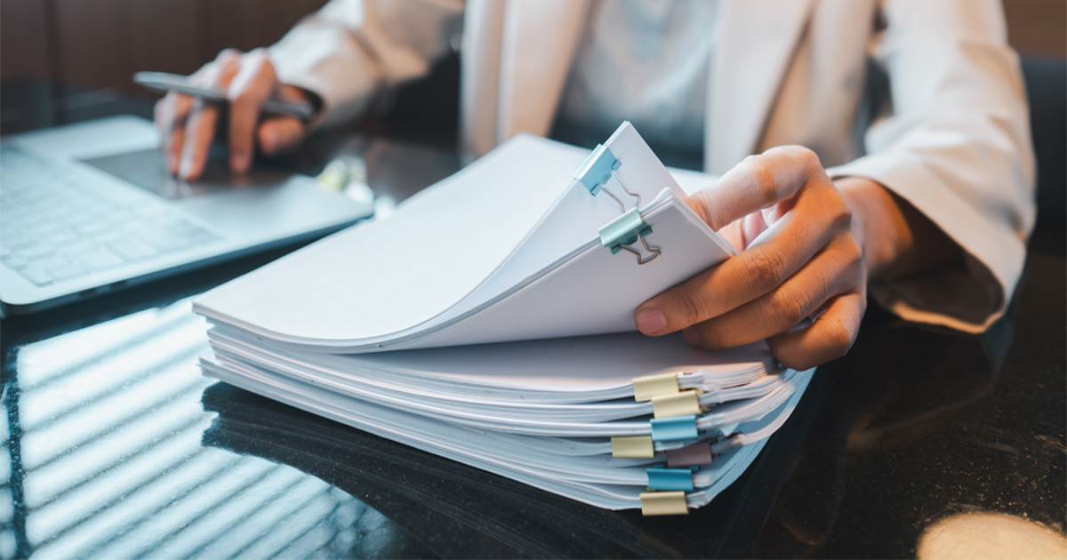 Researcher reviewing EB-1A peer review evidence for an immigration petition.