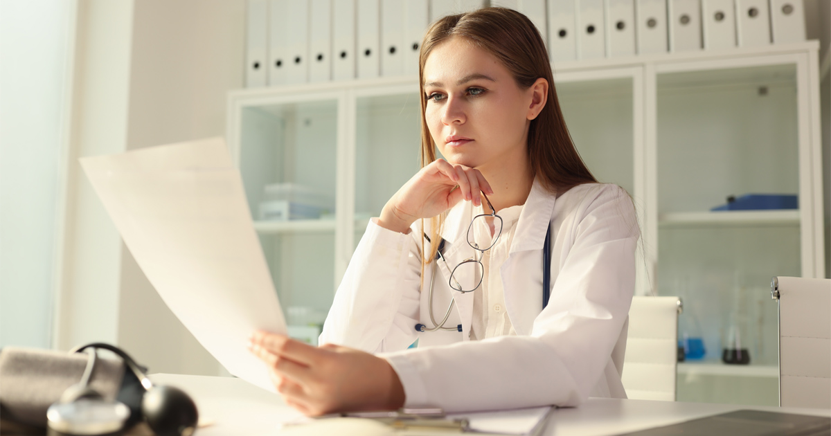PhD professional reviewing documents and research records for EB-1A Readiness for PhDs