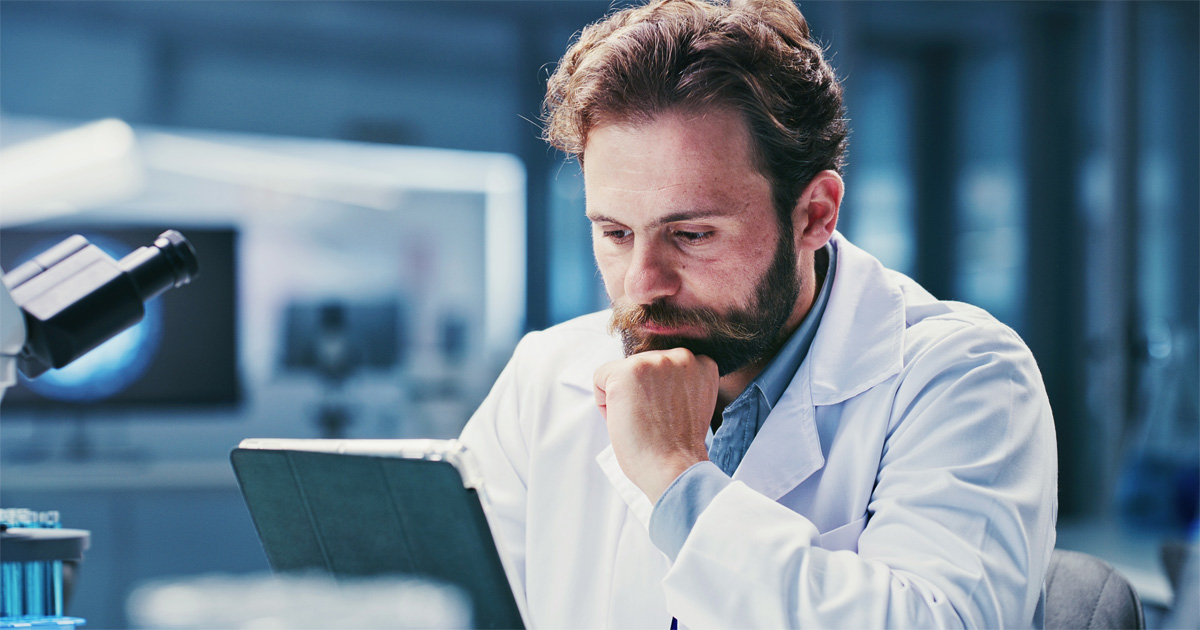Scientist evaluating NIW Readiness for Scientists by reviewing research documents and petition evidence.
