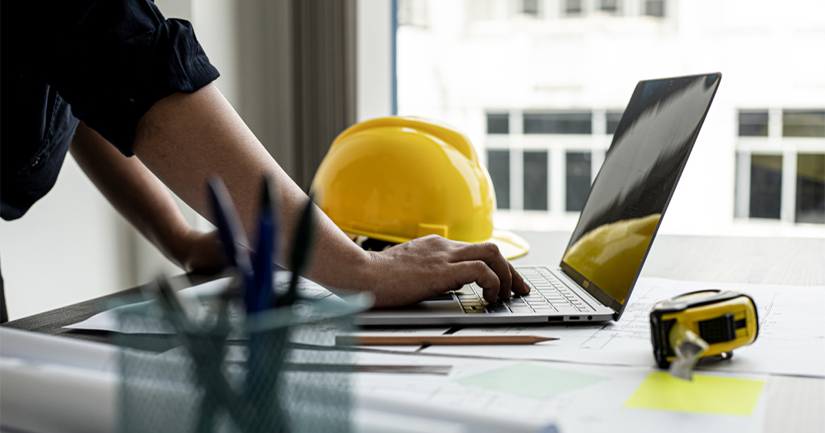 Engineer preparing a Proposed Endeavor for NIW Engineers on a laptop